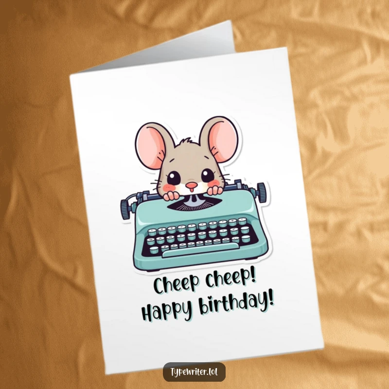 Funny Free Printable Birthday Card: A playful mouse character peeks out from behind a typewriter, ready to celebrate your birthday with a smile.
